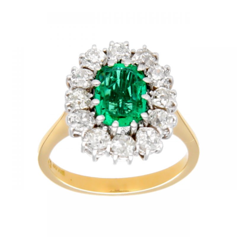 Anello due ori con diamanti e smeraldo centrale